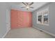 This bedroom features a decorative salmon colored wall and neutral paint at 290 Whistlers Cv, Louisburg, NC 27549