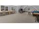 Large bonus room with natural light, perfect for entertainment and crafts at 290 Whistlers Cv, Louisburg, NC 27549