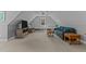 Bonus room features a seating area and built in shelving near the window at 290 Whistlers Cv, Louisburg, NC 27549