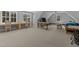Bright bonus room features sewing tables and natural light from many windows at 290 Whistlers Cv, Louisburg, NC 27549