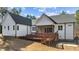 Exterior back of home features a screened porch and wooden deck at 290 Whistlers Cv, Louisburg, NC 27549