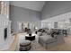 Spacious living room with hardwood floors, fireplace, and open layout with seamless flow to the kitchen at 290 Whistlers Cv, Louisburg, NC 27549