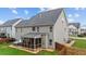 The backyard has a patio, screened in porch, hot tub, and grass at 307 Sugarberry Ln, Clayton, NC 27527