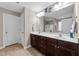 Elegant bathroom featuring a double sink vanity and tiled flooring at 307 Sugarberry Ln, Clayton, NC 27527
