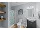 Bathroom featuring a shower/tub combo, blue accents, and vanity at 307 Sugarberry Ln, Clayton, NC 27527