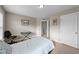 This bedroom has neutral walls, carpet, a chair and keyboard at 307 Sugarberry Ln, Clayton, NC 27527
