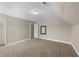 Neutral bedroom with tan colored carpet, tan walls, and minimalist decor at 307 Sugarberry Ln, Clayton, NC 27527