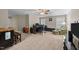 Carpeted room with bar area, desk, and a cozy armchair at 307 Sugarberry Ln, Clayton, NC 27527