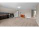 Bonus room with bar area, lots of carpeted floorspace and neutral walls at 307 Sugarberry Ln, Clayton, NC 27527