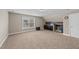 Carpeted bonus room with a wet bar featuring wood accents at 307 Sugarberry Ln, Clayton, NC 27527