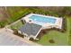 Aerial view of the community pool area with plenty of lounge chairs and clubhouse at 307 Sugarberry Ln, Clayton, NC 27527