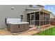 Enjoy the outdoors with this backyard hot tub and screened porch creating a relaxing outdoor oasis at 307 Sugarberry Ln, Clayton, NC 27527