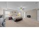 Large main bedroom featuring a decorative fireplace and lots of natural light at 307 Sugarberry Ln, Clayton, NC 27527