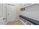 Convenient mudroom with built-in storage, a bench, and easy access to the outdoors at 307 Sugarberry Ln, Clayton, NC 27527
