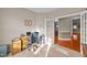 Inviting home office with a wooden desk, a comfortable office chair, and view into the dining room at 307 Sugarberry Ln, Clayton, NC 27527