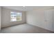 This bedroom boasts natural light from the window at 31 Red Cedar Way, Fuquay Varina, NC 27526