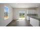 Eat-in kitchen area boasts stainless appliances, recessed lighting and a sliding glass door to the backyard at 31 Red Cedar Way, Fuquay Varina, NC 27526