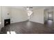 Open-concept living room with fireplace, staircase, and access to the front entry at 31 Red Cedar Way, Fuquay Varina, NC 27526