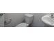 Powder room features a toilet, sink, and chrome towel bar at 31 Red Cedar Way, Fuquay Varina, NC 27526
