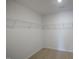 Walk-in closet with wire shelving for optimal storage at 31 Red Cedar Way, Fuquay Varina, NC 27526