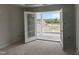 Bedroom with French doors opening to an outdoor balcony with a scenic view at 316 White Oak Garden Way # 217, Garner, NC 27529