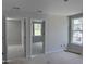 Bedroom showcasing two windows and a view through two open doorways to additional rooms at 316 White Oak Garden Way # 217, Garner, NC 27529