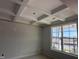 Dining area featuring a decorative coffered ceiling, large window and neutral paint at 316 White Oak Garden Way # 217, Garner, NC 27529