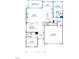 Layout of the home's first floor featuring a kitchen, living spaces, and a guest bedroom at 3176 Armeria Dr, Apex, NC 27502
