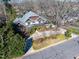 An aerial view reveals a home with mature trees and charming neighborhood streets at 3324 Thomas Rd, Raleigh, NC 27607