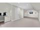 Finished basement area featuring built-in cabinets and shelving as well as a work area at 3324 Thomas Rd, Raleigh, NC 27607