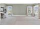 Spacious bedroom featuring two large windows and a built-in desk area for comfortable living at 3324 Thomas Rd, Raleigh, NC 27607
