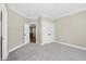 Inviting bedroom with neutral carpet, ample closet space, and doorway through to a secondary room at 3324 Thomas Rd, Raleigh, NC 27607