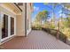 A spacious wooden deck with a dark brown railing offers outdoor enjoyment and relaxation at 3324 Thomas Rd, Raleigh, NC 27607