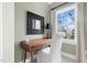 Bedroom desk area features a sleek wooden desk, comfortable chair, and a large window at 3324 Thomas Rd, Raleigh, NC 27607