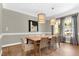 Cozy dining room with a wooden table, wicker chairs, and natural lighting at 3324 Thomas Rd, Raleigh, NC 27607