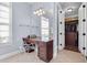Dressing area with vanity and natural light next to walk-in closet provides comfortable getting ready space at 3324 Thomas Rd, Raleigh, NC 27607