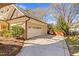 A spacious driveway leads to a two-car garage and fenced backyard at 3324 Thomas Rd, Raleigh, NC 27607