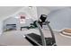 Well-lit exercise room featuring a treadmill, weights, and an exercise bench, perfect for fitness enthusiasts at 3324 Thomas Rd, Raleigh, NC 27607