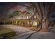 A stunning home exterior with professional landscaping and a long driveway at 3324 Thomas Rd, Raleigh, NC 27607