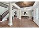 Open-concept foyer with staircase, dining area, hardwood floors and natural light at 3324 Thomas Rd, Raleigh, NC 27607