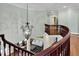 Overhead view of the foyer with a winding staircase leading into an open living room at 3324 Thomas Rd, Raleigh, NC 27607
