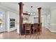 Bright kitchen featuring wood floors, a center island with seating, and stainless steel appliances at 3324 Thomas Rd, Raleigh, NC 27607