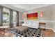 Cozy living room featuring natural light, a modern area rug, and a white sofa at 3324 Thomas Rd, Raleigh, NC 27607