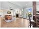 Sunlit living room featuring a fireplace, built-in shelving, and access to the deck at 3324 Thomas Rd, Raleigh, NC 27607