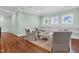 Inviting seating area with four comfortable armchairs, an ottoman, and built-in shelving at 3324 Thomas Rd, Raleigh, NC 27607