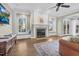 Inviting living room featuring a fireplace, built-in shelving, and hardwood flooring at 3324 Thomas Rd, Raleigh, NC 27607
