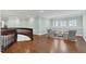 Upstairs loft space features hardwood floors, neutral walls, and a sitting area with windows at 3324 Thomas Rd, Raleigh, NC 27607
