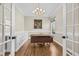 Bright office space featuring custom built-ins, a modern desk, and natural light at 3324 Thomas Rd, Raleigh, NC 27607