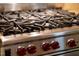 Close-up of professional-grade gas range with precise temperature controls and durable grates at 3324 Thomas Rd, Raleigh, NC 27607
