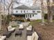 Expansive backyard featuring a patio with comfortable seating, outdoor kitchen, and meticulously landscaped grounds at 3359 Hampton Rd, Raleigh, NC 27607